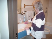 blind person cleaning the bathroom